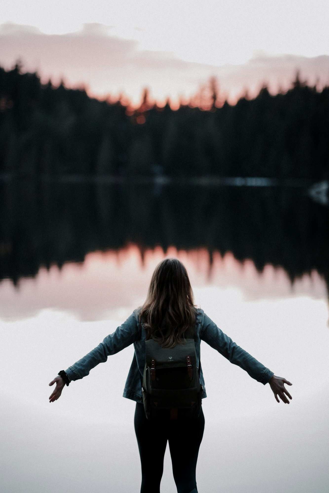 Woman standing in front of Lake